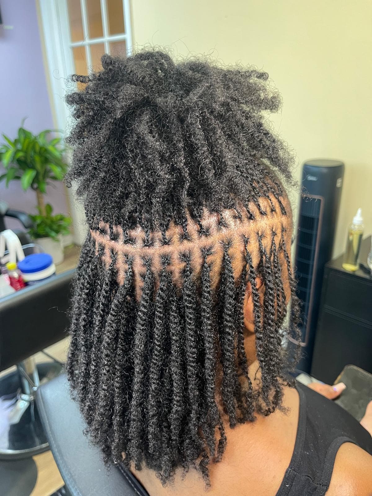 Woman with beautifully styled microlocs